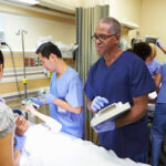 Emergency Medicine Physician with patient