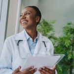 Locum tenens doctor consulting with a colleague at a hospital