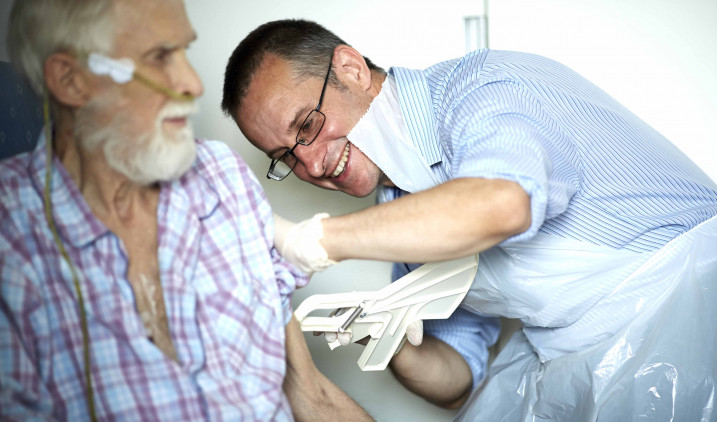 Doctor checking patient's pulse