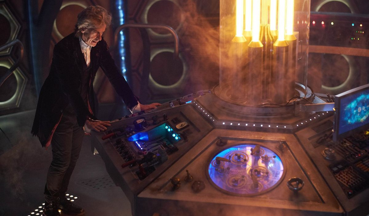 The Twelfth Doctor stands at the TARDIS console as he prepares to regenerate.