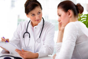 doctor consults with patient