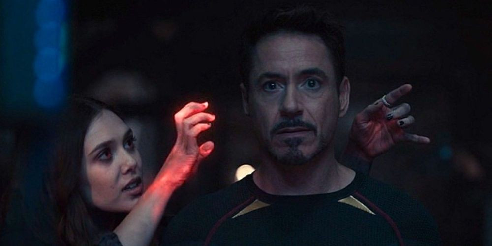 Wanda Maximoff Scarlet Witch uses her telepathy on Tony Stark in Avengers: Age of Ultron movie