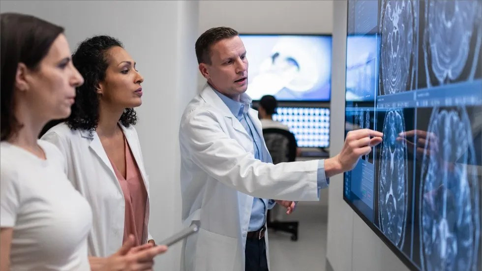 Neurologist examining brain scans